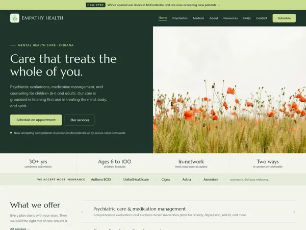 Empathy Health home page, a forest green panel with a welcoming headline beside a field of poppies.